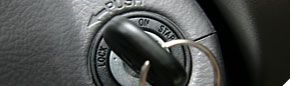photo of a key in the ignition of an automobile